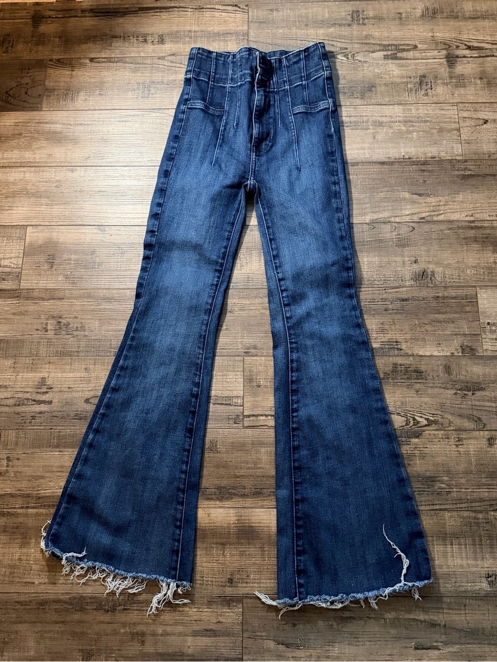 We the Free Dark Blue High-Rise Flare Jeans with Raw Hem